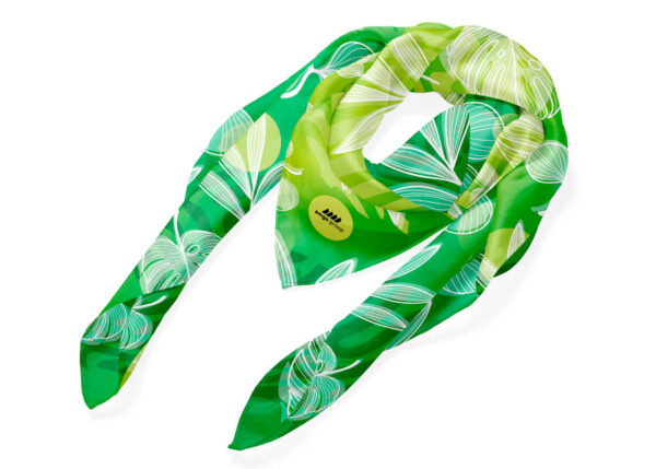 Personalized scarf with a green-toned print featuring leaf designs. Perfect for concerts and corporate events. AMGS Group.