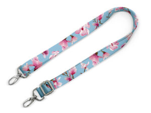 A personalized bag strap with sublimation printing. Available in two widths, adjustable length, and durable hardware. An ideal promotional accessory. AMGS Group.