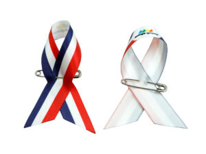 Set of satin awareness ribbon pins in tricolor and white-red design, one-side printed, manufacturer AMGS Group.
