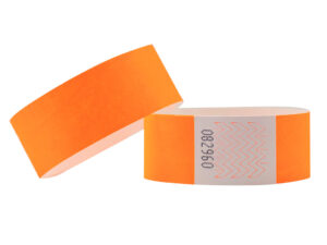 Neon orange Tyvek wristband, 25mm wide. High-visibility ID band with tamper-proof adhesive closure. Manufacturer AMGS Group.